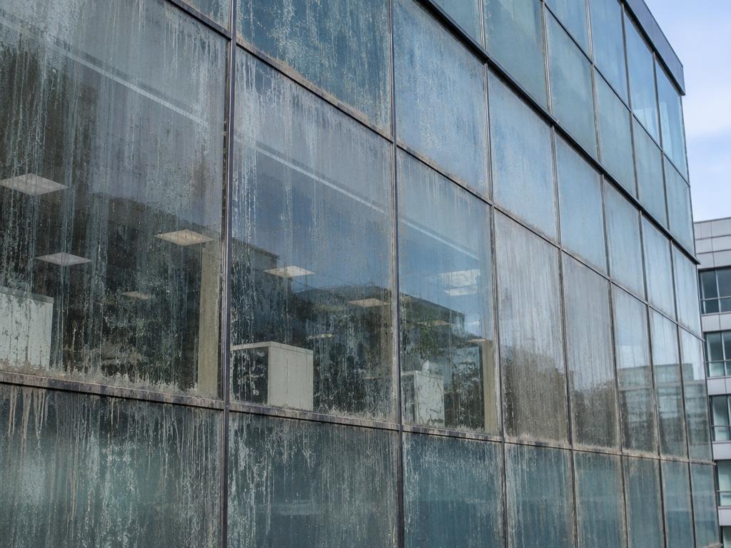 Glass façade cleaning, before